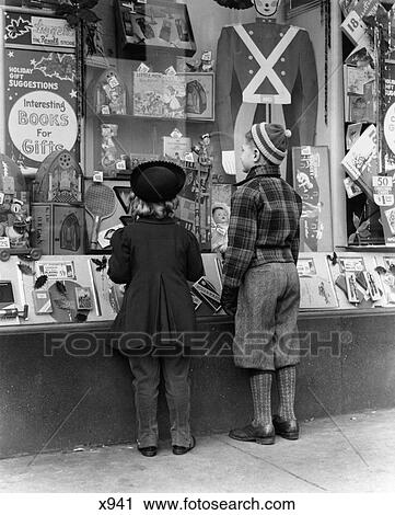 1930S 1940S Boy & Girl Looking In Toy Store Window View Large Photo Image Stock Image - 1930S 1940S Boy & Girl Looking In Toy Store Window. Fotosearch