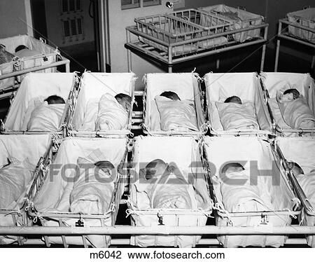 1930S 1940S Hospital Infirmary Newborn Infant Babies Lying Sleeping In Medical Bassinets View Large Photo Image Stock Image - 1930S 1940S Hospital Infirmary Newborn Infant Babies Lying Sleeping In Medical Bassinets. Fotosearch