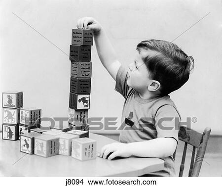 1930S Boy Stacking Playing With Nursery Rhyme Theme Building Blocks Toys View Large Photo Image Picture - 1930S Boy Stacking Playing With Nursery Rhyme Theme Building Blocks Toys. Fotosearch