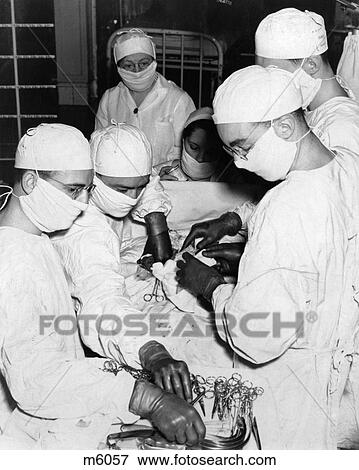 Stock Photo - 1930S Surgical Team In Operating Room. Fotosearch