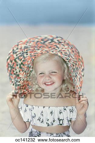 1940S 1950S Smiling Blond Girl At Beach Wearing Two Piece Bathing Suit And Straw Hat View Large Photo Image Stock Image - 1940S 1950S Smiling Blond Girl At Beach Wearing Two Piece Bathing Suit And Straw Hat. Fotosearch