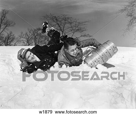 1940S Couple Laughing Falling Off Snow Sled View Large Photo Image Stock Photo - 1940S Couple Laughing Falling Off Snow Sled. Fotosearch