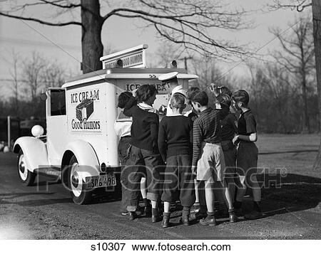 Stock Photo - 1940S Group Of Boys Crowding Around Ice Cream Man At Back Of Good Humor Truck. Fotosearch