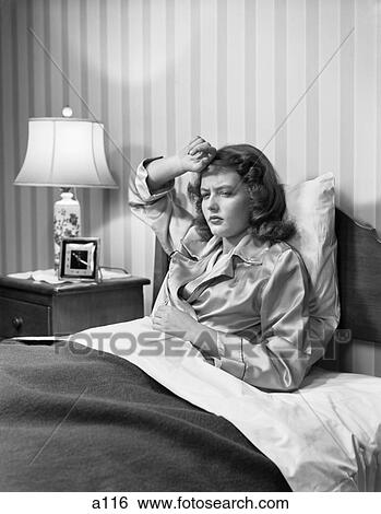 1940S Young Woman Teenager Sick In Bed Hand On Head And Stomach View Large Photo Image Stock Photograph - 1940S Young Woman Teenager Sick In Bed Hand On Head And Stomach . Fotosearch
