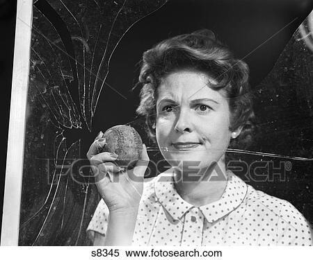 1950S Woman Housewife Mother Neighbor Frowning Holding Baseball By Cracked Window Glass Mischief Accident View Large Photo Image Stock Photography - 1950S Woman Housewife Mother Neighbor Frowning Holding Baseball By Cracked Window Glass Mischief Accident. Fotosearch
