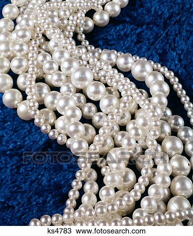 1960S 1970S Large And Small Pearl Strand Necklaces Real And Faux Pop Beads On Blue Fabric View Large Photo Image Stock Image - 1960S 1970S Large And Small Pearl Strand Necklaces Real And Faux Pop Beads On Blue Fabric . Fotosearch
