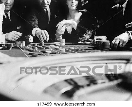 1960S Four Anonymous Unidentified People Gambling Casino Roulette View Large Photo Image Stock Photo - 1960S Four Anonymous Unidentified People Gambling Casino Roulette. Fotosearch