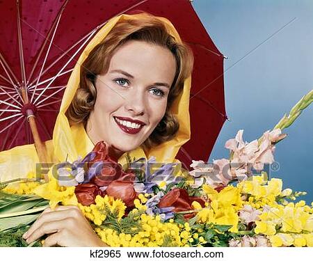 1960S Smiling Woman Under Red Umbrella Yellow Raincoat Holding Spring Flowers View Large Photo Image Stock Photography - 1960S Smiling Woman Under Red Umbrella Yellow Raincoat Holding Spring Flowers . Fotosearch