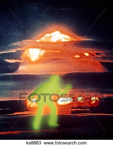 1970S Glowing Green Shadow Anonymous Man Against Red Orange Glowing Atomic Bomb Mushroom Cloud View Large Photo Image Stock Image - 1970S Glowing Green Shadow Anonymous Man Against Red Orange Glowing Atomic Bomb Mushroom Cloud. Fotosearch