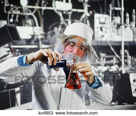 1970S Man Crazy Loony Mad Scientist Chemist In Laboratory Pouring Chemicals From One Beaker To Another View Large Photo Image Stock Image - 1970S Man Crazy Loony Mad Scientist Chemist In Laboratory Pouring Chemicals From One Beaker To Another. Fotosearch
