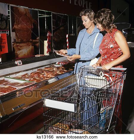 1970S Two Women Mother And Daughter Pushing A Shopping Cart In Meat Department Of Supermarket View Large Photo Image Stock Photograph - 1970S Two Women Mother And Daughter Pushing A Shopping Cart In Meat Department Of Supermarket. Fotosearch