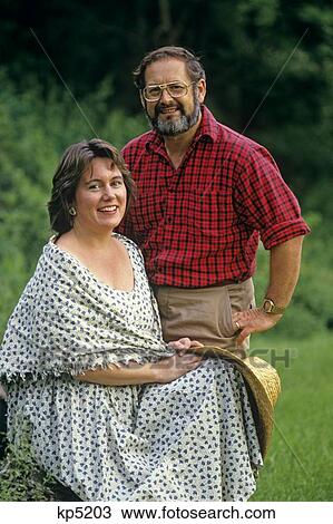 1980S 1990S Portrait Smiling Couple Looking At Camera View Large Photo Image Stock Image - 1980S 1990S Portrait Smiling Couple Looking At Camera. Fotosearch