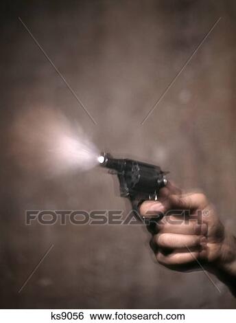 1980S Blur Motion Of A Hand Shooting Revolver Gun Smoke And Flash Coming Out Of Muzzle View Large Photo Image Stock Photograph - 1980S Blur Motion Of A Hand Shooting Revolver Gun Smoke And Flash Coming Out Of Muzzle. Fotosearch