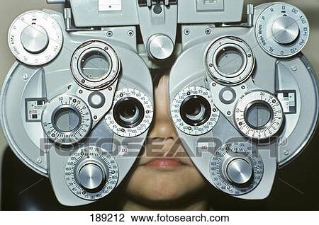1980S Child At Optomotrist Looking Into Phoropter During Eye Examination View Large Photo Image Stock Image - 1980S Child At Optomotrist Looking Into Phoropter During Eye Examination. Fotosearch