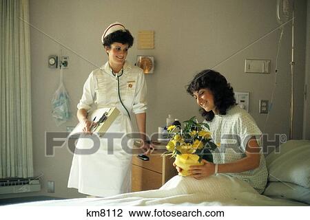 1980S Nurse & Woman Patient Flowers View Large Photo Image Stock Image - 1980S Nurse & Woman Patient Flowers . Fotosearch
