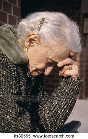 1980S Older Woman Holding Head In Hand View Large Photo Image Stock Photography - 1980S Older Woman Holding Head In Hand . Fotosearch