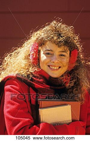 1980S Teenage Girl Wearing Earmuffs And Carrying Books Looking At Camera View Large Photo Image Stock Photography - 1980S Teenage Girl Wearing Earmuffs And Carrying Books Looking At Camera. Fotosearch