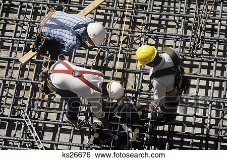 1980S Three Construction Ironworkers Bending Over Rebar View Large Photo Image Stock Photograph - 1980S Three Construction Ironworkers Bending Over Rebar. Fotosearch