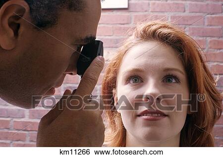 1990S African American Ophthalmologist Examining Woman'S Eyes Close-Up View Large Photo Image Stock Photograph - 1990S African American Ophthalmologist Examining Woman'S Eyes Close-Up . Fotosearch