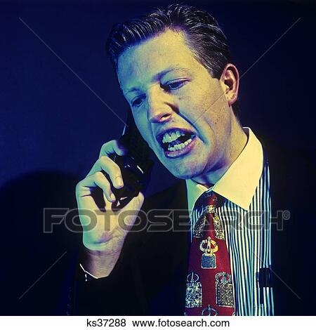 1990S Angry Man On Screaming On Cellular Phone View Large Photo Image Stock Photo - 1990S Angry Man On Screaming On Cellular Phone . Fotosearch
