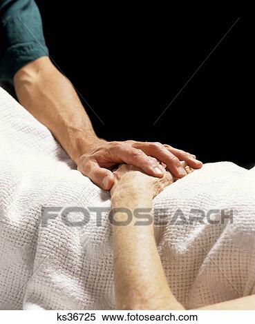 1990S Close-Up Of Physicians Hand Resting On Hands Of Elderly Person View Large Photo Image Stock Photography - 1990S Close-Up Of Physicians Hand Resting On Hands Of Elderly Person . Fotosearch