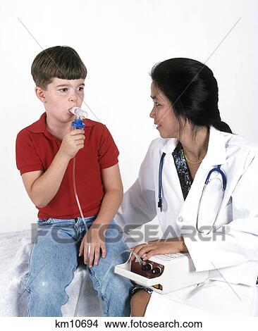 1990S Doctor With Child Using Nebulizer View Large Photo Image Picture - 1990S Doctor With Child Using Nebulizer. Fotosearch