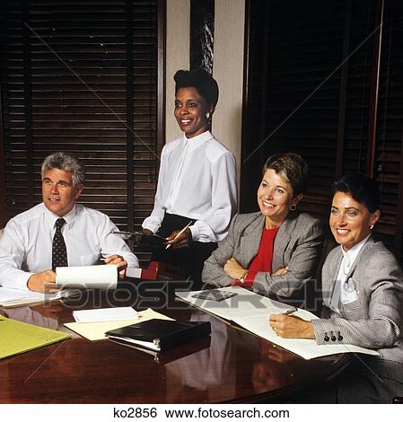 Stock Photograph - 1990S Executives At Conference Table . Fotosearch