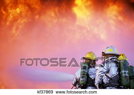 1990S Firefighters Training At Fire Pit View Large Photo Image Stock Photo - 1990S Firefighters Training At Fire Pit. Fotosearch