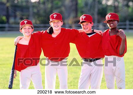 Stock Photo - 1990S Four Boys In Baseball Uniforms. Fotosearch