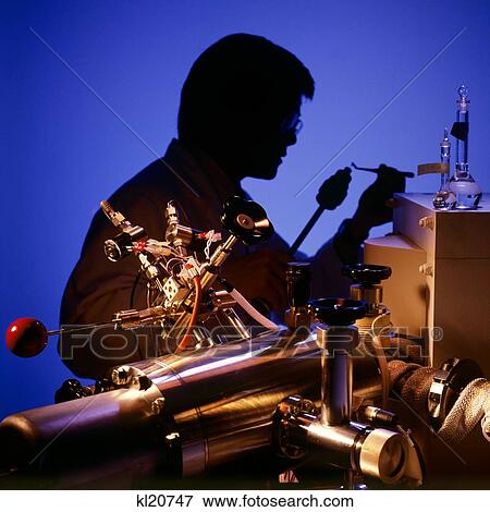 1990S Pharmaceutical Lab Technician Loading Sample View Large Photo Image Stock Photo - 1990S Pharmaceutical Lab Technician Loading Sample . Fotosearch
