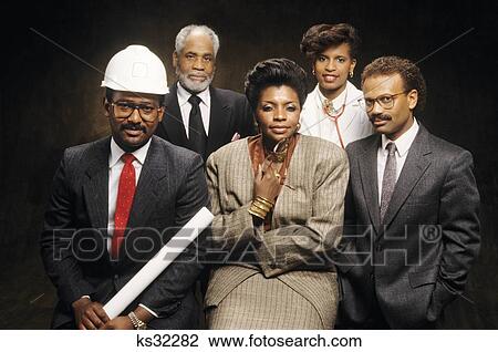 Stock Image - 1990S Portrait Of African American Professional Men And Women Architect Doctor And Business Executives Looking At Camera . Fotosearch