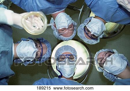 Stock Photography - 1990S Surgical Team In Operating Room . Fotosearch