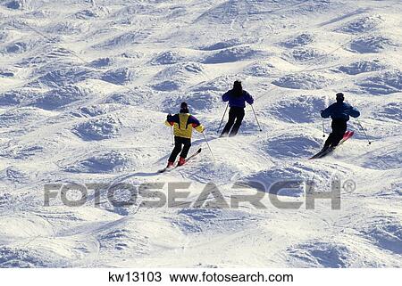 1990S Three Adult Skiers Skiing On Mogul Bump Trail Mount Snow Vermont Usa View Large Photo Image Stock Image - 1990S Three Adult Skiers Skiing On Mogul Bump Trail Mount Snow Vermont Usa. Fotosearch