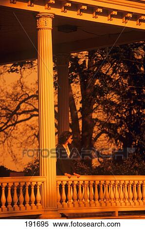 Stock Photography - 1990S Woman Standing On Porch . Fotosearch