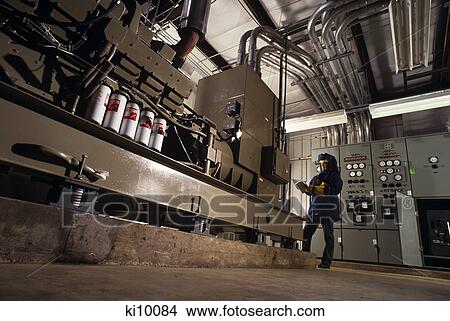 1990S Woman Technician Maintaining Emergency Power Generator In Hospital View Large Photo Image Picture - 1990S Woman Technician Maintaining Emergency Power Generator In Hospital. Fotosearch