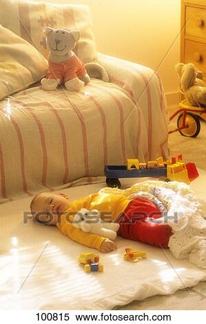 Baby Sleeping On Blanket With Toys View Large Photo Image Stock Photography - Baby Sleeping On Blanket With Toys . Fotosearch