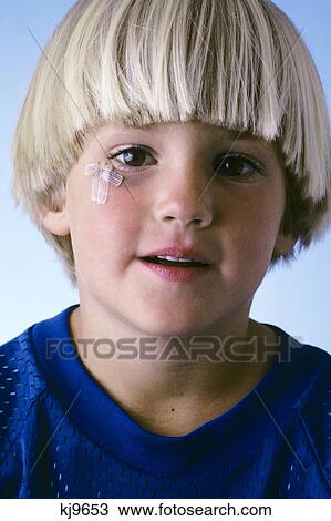 Blond Boy With A Cut On His Cheek View Large Photo Image Stock Image - Blond Boy With A Cut On His Cheek . Fotosearch