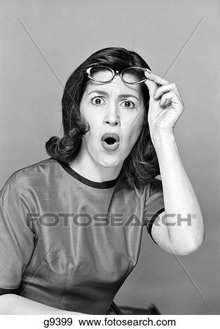 Brunette Woman Portrait Reaction Shot Surprise Hand Pushing Up Eye Glasses View Large Photo Image Stock Photo - Brunette Woman Portrait Reaction Shot Surprise Hand Pushing Up Eye Glasses. Fotosearch