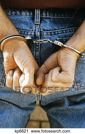 Close-Up Of Male Hands With Handcuffs View Large Photo Image Stock Image - Close-Up Of Male Hands With Handcuffs . Fotosearch