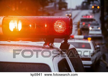Close-Up Of Red Lights On Top Of Emergency Vehicles At Accident Site At Dusk View Large Photo Image Stock Image - Close-Up Of Red Lights On Top Of Emergency Vehicles At Accident Site At Dusk. Fotosearch