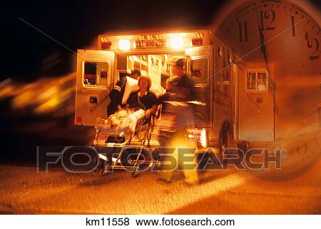 Stock Photo - Composite Image Patient Being Put Into Ambulance And Clock . Fotosearch