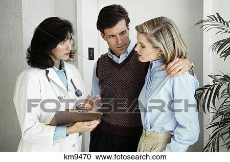 Couple Consulting With Doctor View Large Photo Image Stock Image - Couple Consulting With Doctor . Fotosearch