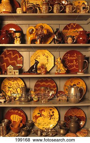 Stock Photo - Cupboard With American Redware Pottery . Fotosearch