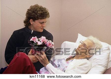 Grandson Visiting Great Grandmother In Hospital View Large Photo Image Stock Photo - Grandson Visiting Great Grandmother In Hospital . Fotosearch