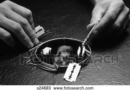 Hands Holding A Razor Blade And Rolled Up $20. 00 Bill Over Mirror Covered With Cocaine And Reflection Of Death Head Skull View Large Photo Image Stock Image - Hands Holding A Razor Blade And Rolled Up $20. 00 Bill Over Mirror Covered With Cocaine And Reflection Of Death Head Skull. Fotosearch