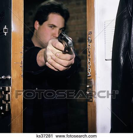 Man Pointing Gun Through Doorway View Large Photo Image Stock Image - Man Pointing Gun Through Doorway . Fotosearch