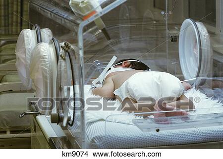 Newborn Infant Is Kept Warm In Hospital Nursery View Large Photo Image Picture - Newborn Infant Is Kept Warm In Hospital Nursery . Fotosearch