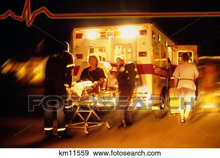 Stock Photo - Patient Being Put Into Ambulance With PulseHeart Ekg Symbol. Fotosearch