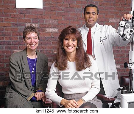Stock Photography - Portrait Of Optometrist'S Office Staff . Fotosearch