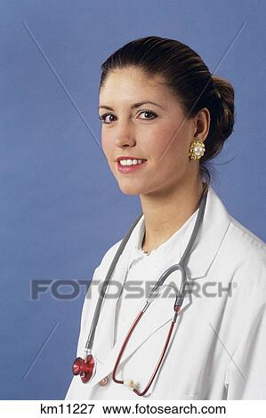 Stock Photo - Portrait Of Woman Physician Looking At Camera . Fotosearch